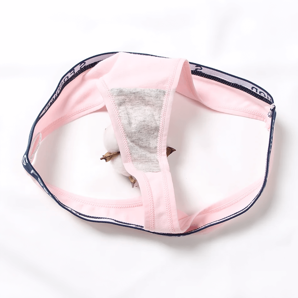 Women's stretch cotton thong with elastic waistband, soft pink color, breathable and sleek for everyday comfort.