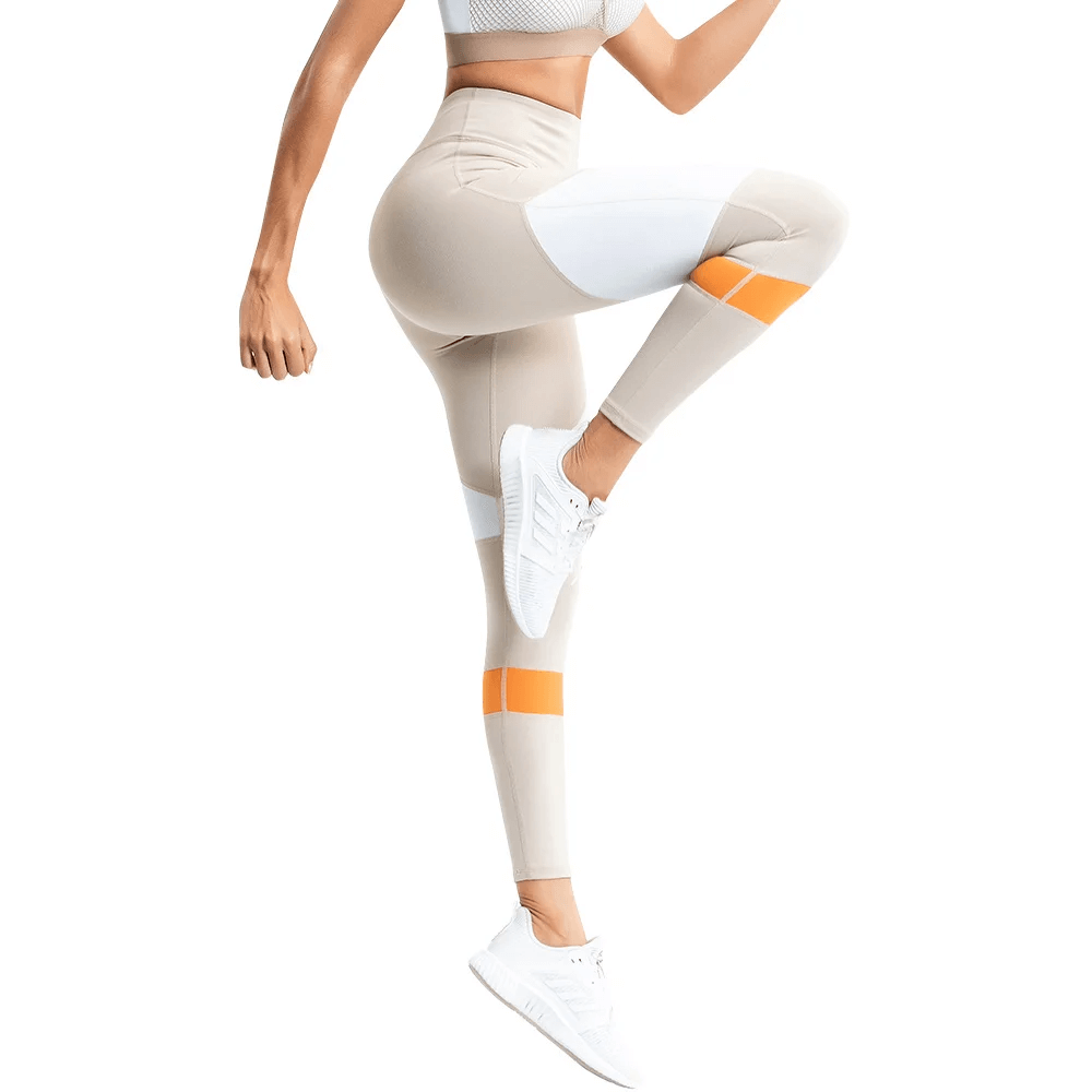 Woman in high-waisted leggings with vibrant accents, ideal for yoga, running, gym. Moisture-wicking fabric, stylish and supportive fit.