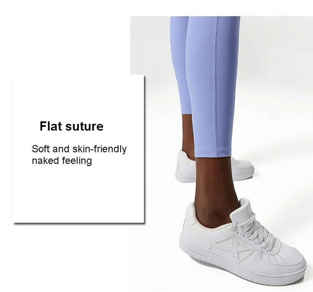 Close-up of light blue leggings with white sneakers, showcasing soft, skin-friendly fabric and flat suture design for yoga or gym use.