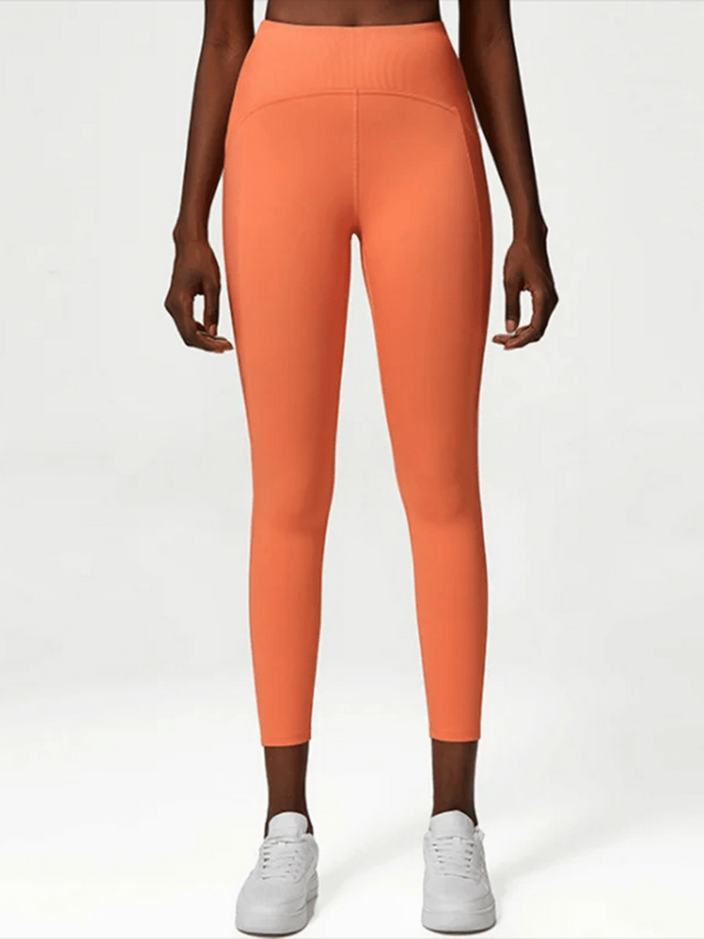 Orange stylish yoga and gym stretch leggings SF2100 with elastic waistband for versatile athletic wear.
