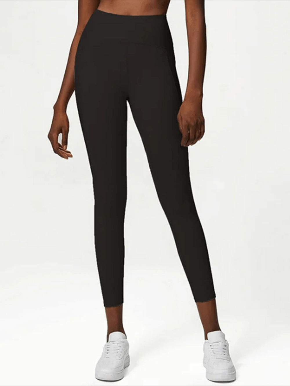 Model wearing black Women's Stylish Yoga and Gym Stretch Leggings for versatile sports activities.