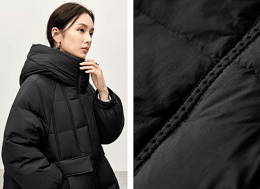 Women's black hooded duck down puffer jacket with stand neck, close-up of fabric detail showcasing texture and stitching.