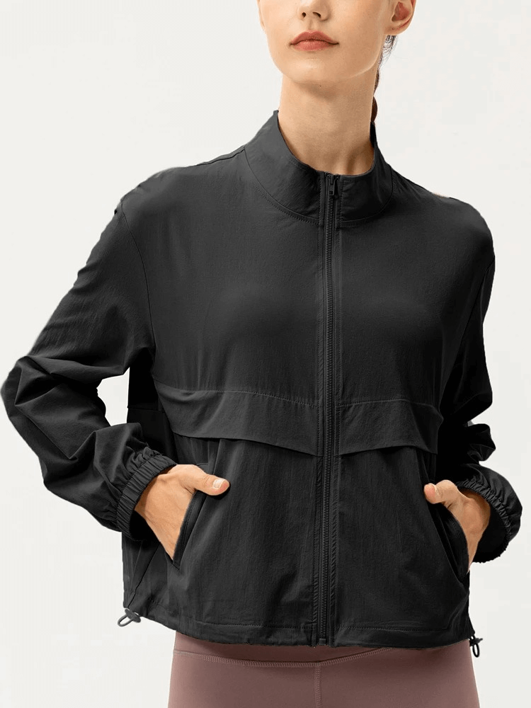 Woman wearing black UV protection running windbreaker SF1916, lightweight and breathable with turn-down collar.