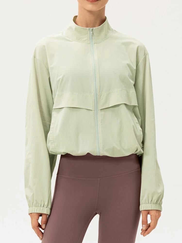 Women's UV protection running windbreaker in light green, lightweight and breathable, ideal for outdoor sports, featuring a turn-down collar.