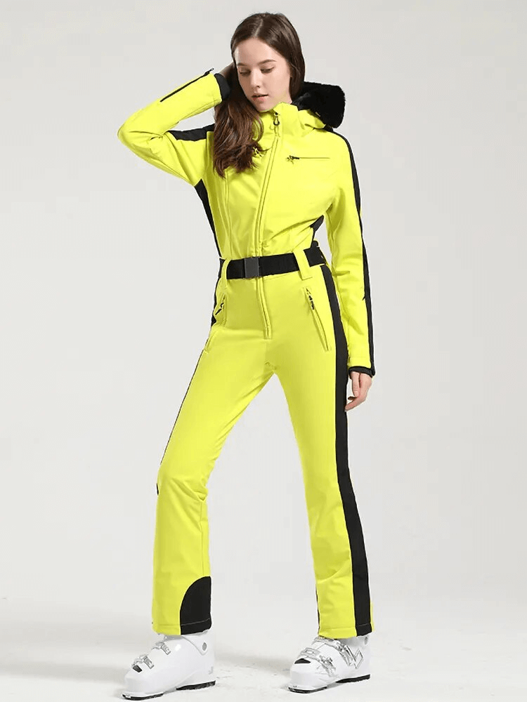 Bright yellow women's one-piece ski suit with hood, showcasing sleek design for peak performance and warmth on the slopes.