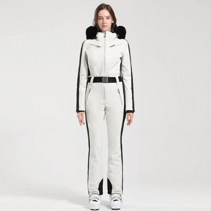 Women's warm one-piece ski suit with hood in white, showcasing windproof and waterproof features for maximum warmth and performance.