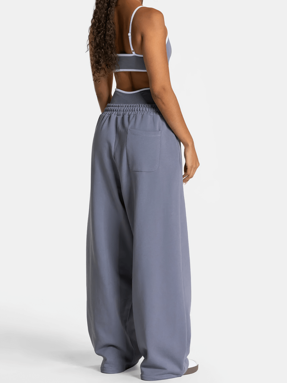 Back view of Women's Wide-Leg Running Pants with Elastic Waist - SF4264 in blue, showcasing loose fit and deep pockets.