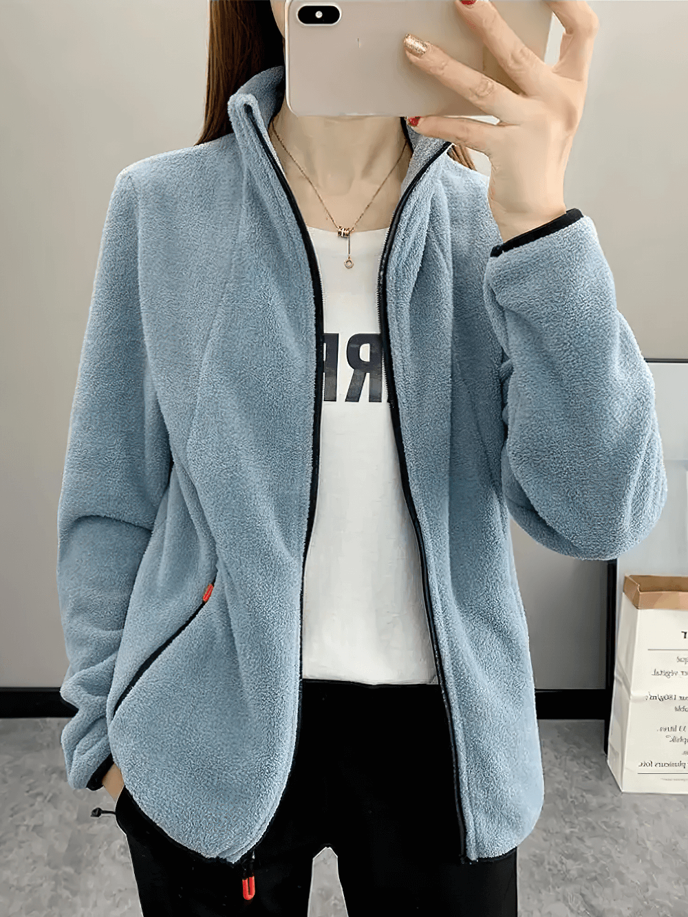 Woman wearing Women's Windproof Thermal Fleece Jacket for Hiking - SF4085, featuring a stylish blue fleece, perfect for outdoor adventures.