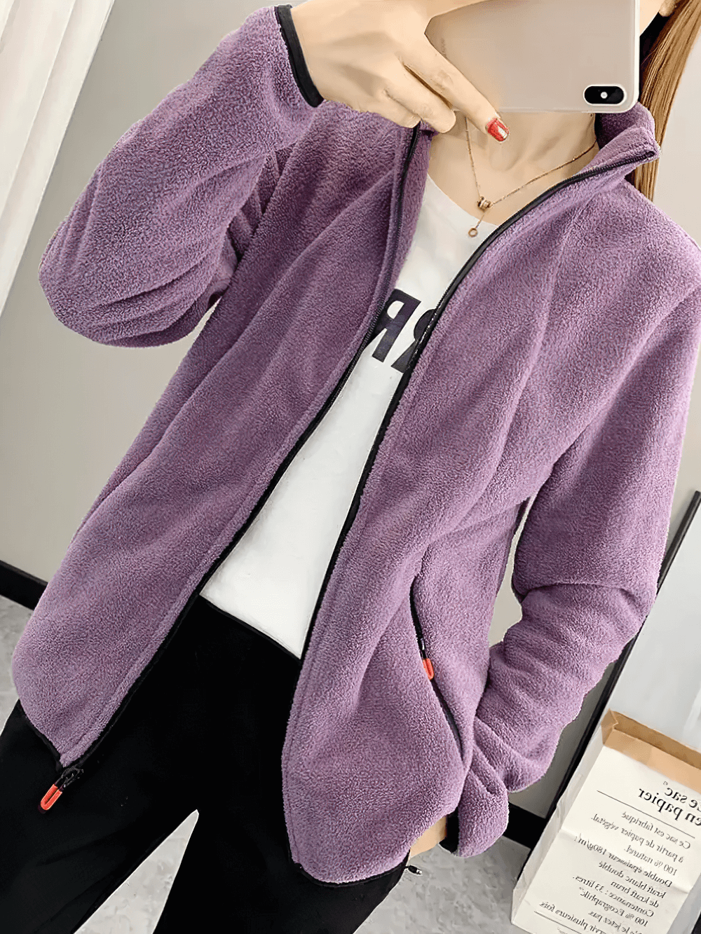 Alt Tag: Woman wearing Women's Windproof Thermal Fleece Jacket for Hiking - SF4085 in purple, with zip pockets and stand collar.