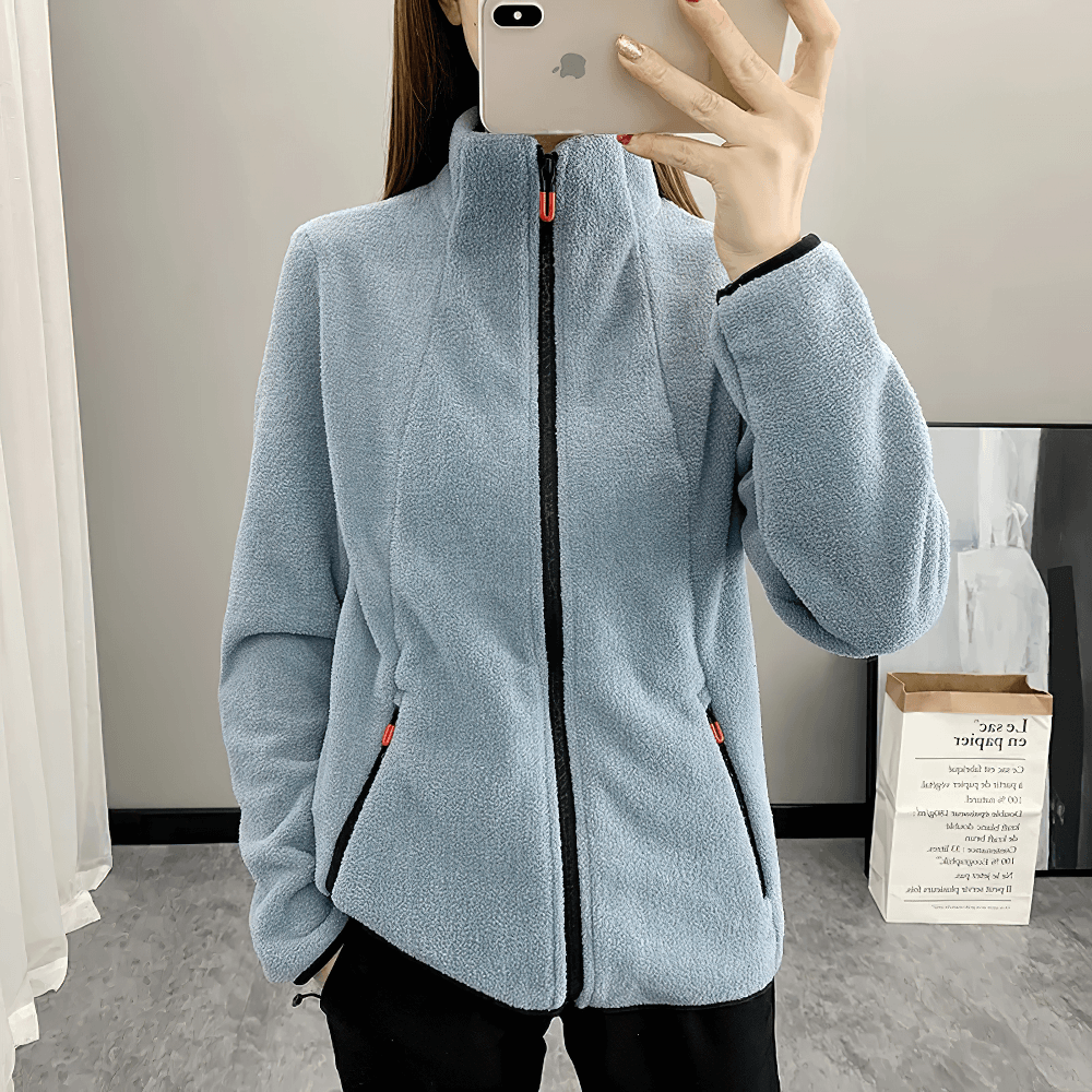 Model in blue Women's Windproof Thermal Fleece Jacket for Hiking - SF4085, featuring anti-static zip design and stand collar.