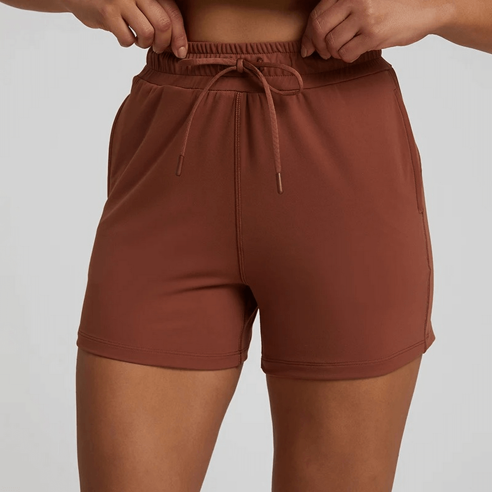 Women's workout shorts with elastic waistband in brown, perfect for gym or casual wear. High waist, durable nylon, spandex blend.