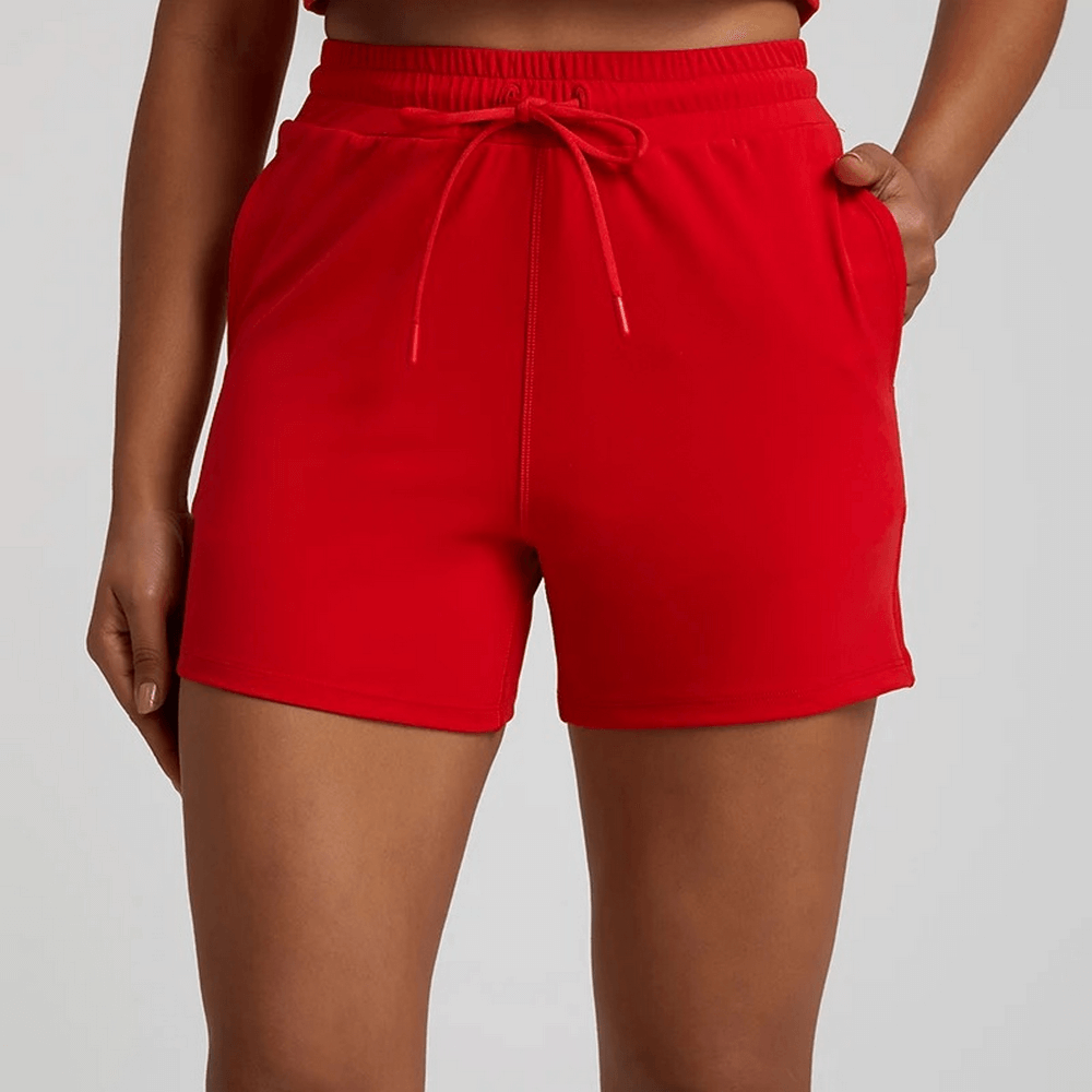Women's workout shorts in vibrant red with elastic waistband, perfect for gym or casual wear.