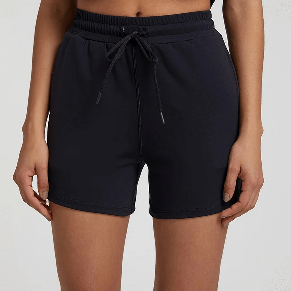 Women's black workout shorts with elastic waistband, solid color design, ideal for gym or casual wear, high waist, nylon and spandex blend.