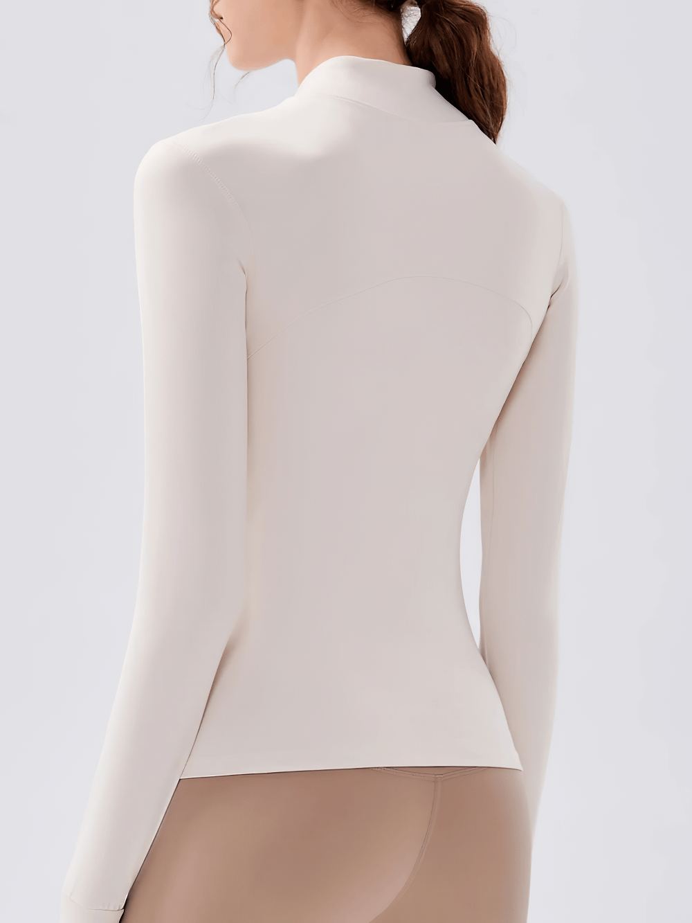 Back view of Women's Zip-Up Running Training Jacket Stand Collar - SF4030 in beige, showcasing a fitted silhouette and breathable fabric.