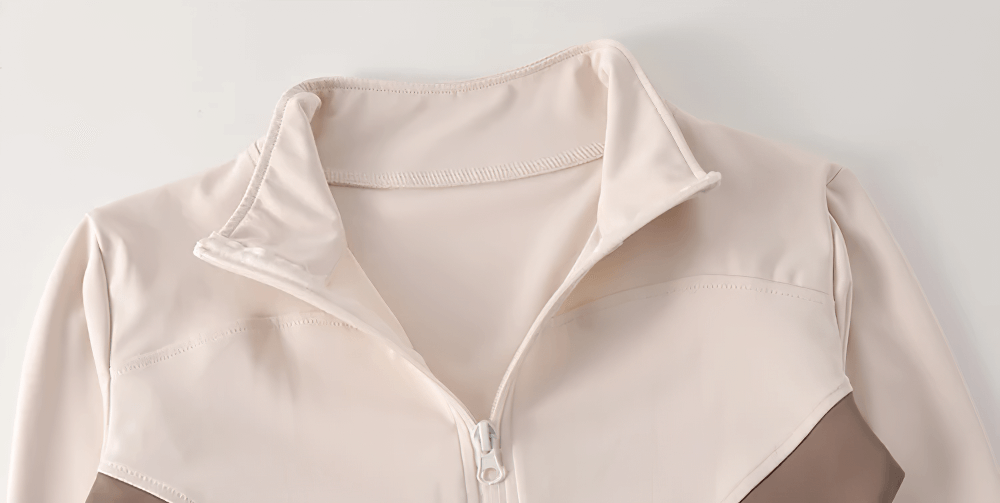 Close-up of Women's Zip-Up Turtleneck Yoga Jacket with Thumbholes - SF4050 showcasing neck and zip details in cream and brown.