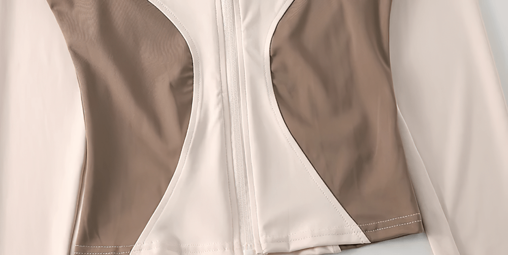 Close-up of Women's Zip-Up Turtleneck Yoga Jacket with Thumbholes - SF4050, featuring sleek patch design panels and smooth zip-in front.