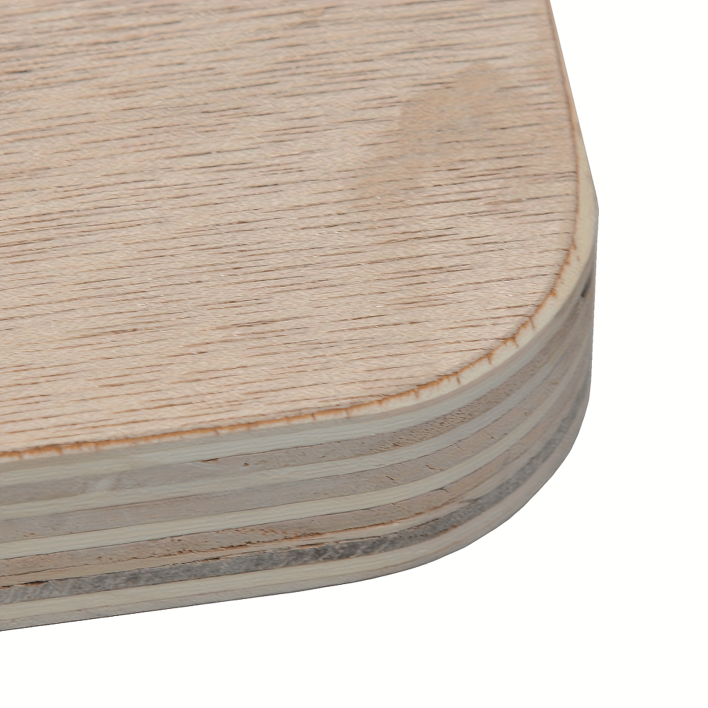 Close-up of the corner of a wooden balance board showing layered plywood and smooth finish.