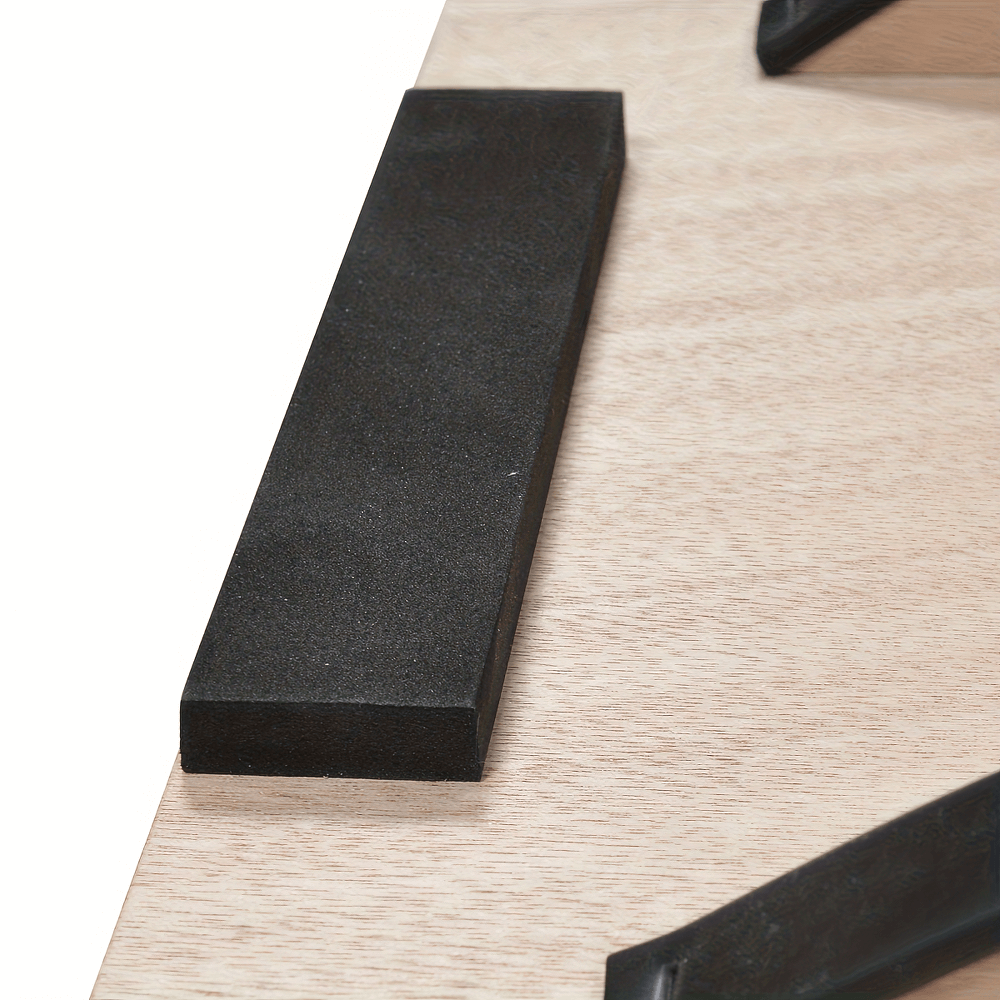 Close-up of wooden balance board with anti-slip surface for stability training and exercises, featuring a durable design.