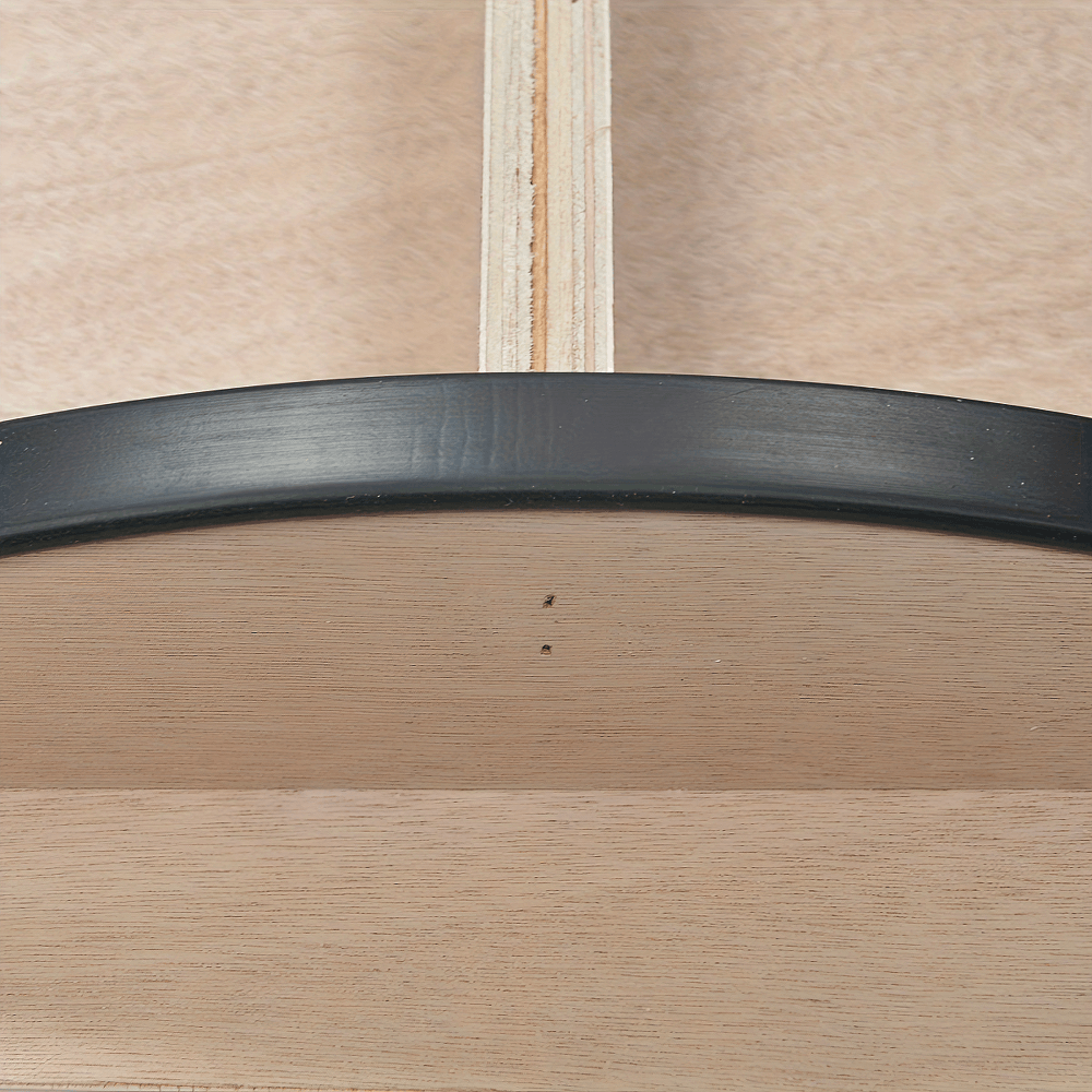 Close-up of wooden balance board with anti-slip feature and dual-directional rocker for stability training and physical therapy.