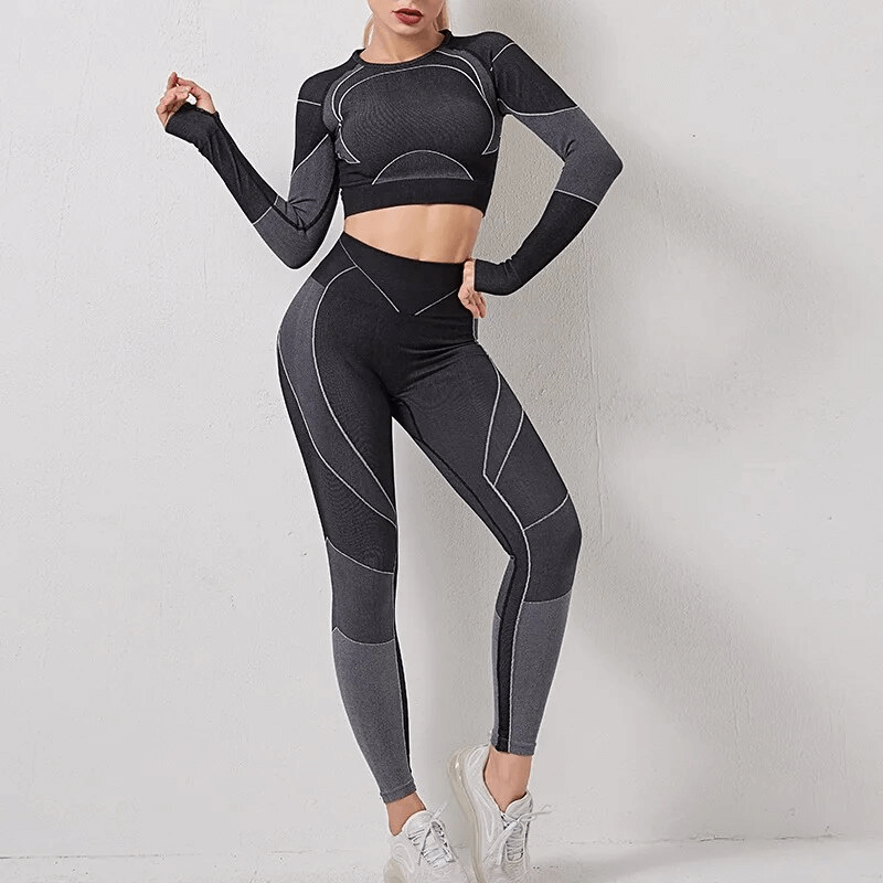 Woman in a workout long sleeve suit and leggings, made of breathable nylon and spandex. Ideal for running, sports, and fitness activities.