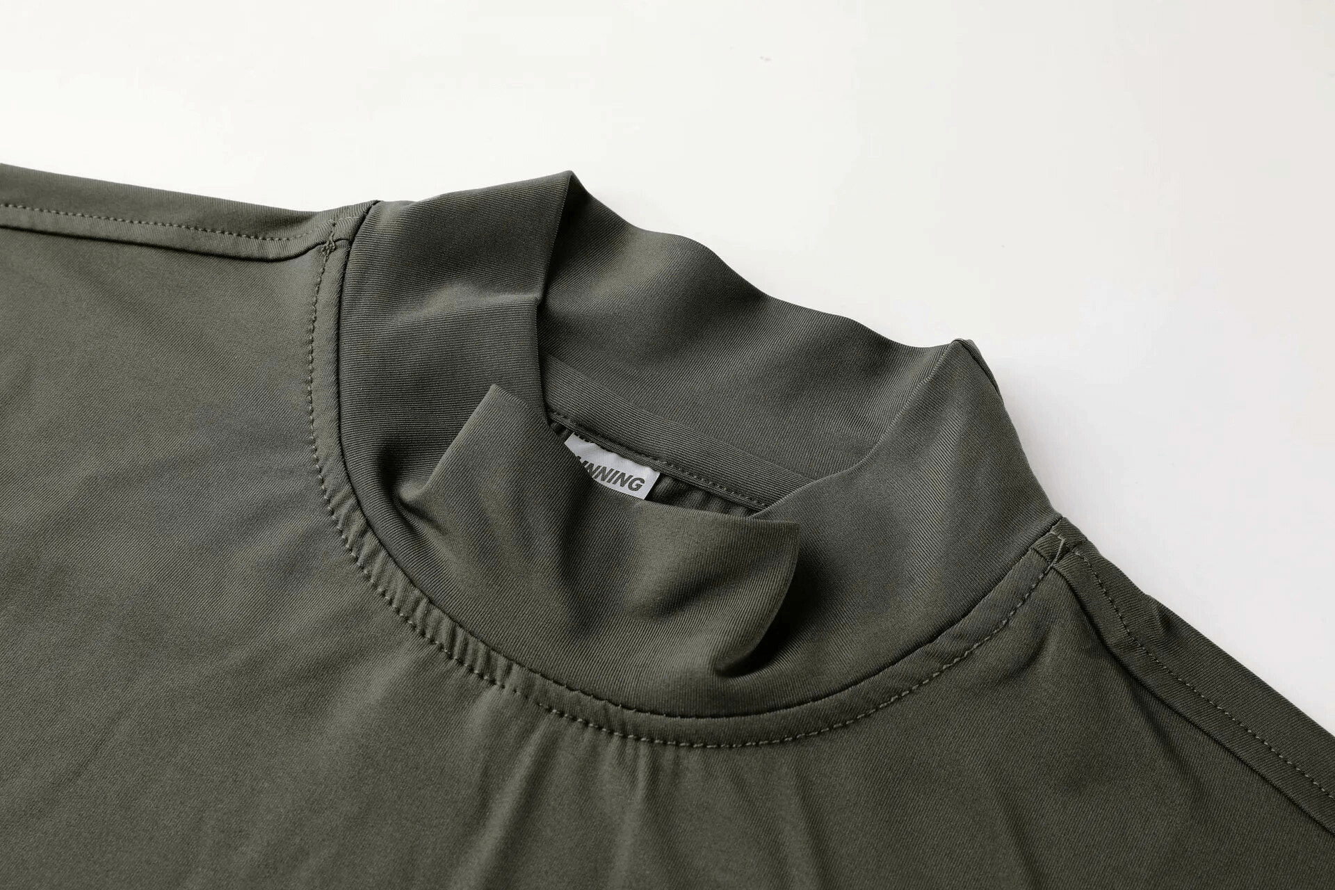 Turtleneck workout top for men, long sleeves, compression fit, solid color, perfect for all-season activewear.