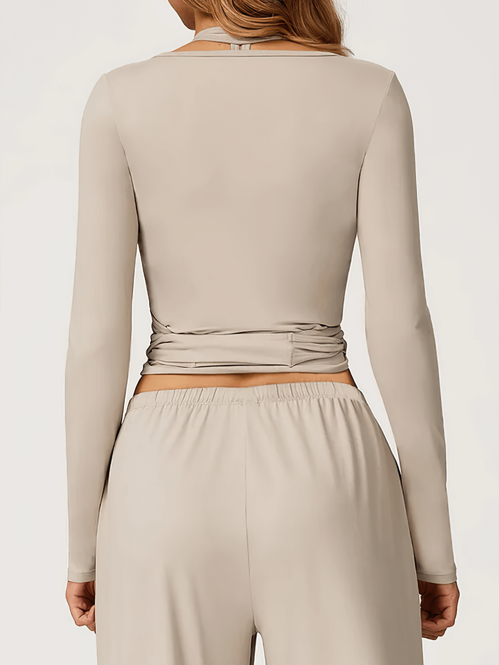 Back view of Yoga Long Sleeve Top for Women with Wrap Tie Detail - SF4184 showcasing the stylish wrap tie design and breathable material.