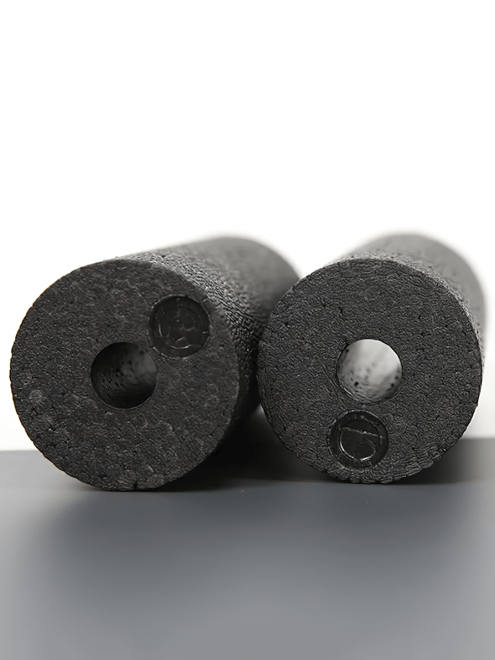 Compact EPP yoga rollers for muscle relaxation and fitness, shown side by side, highlighting their hollow core design for portability.