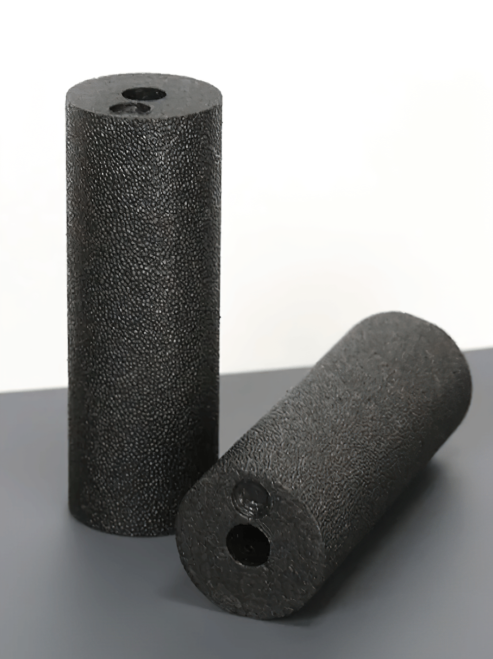 Two black EPP yoga rollers for muscle relaxation and fitness. Compact and portable design for effective stretching and muscle relief.