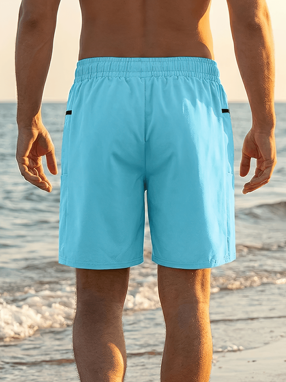 Zip Pocket Swim Trunks with Drawstring Waist - SF4494 men's light blue board shorts with elastic waistband and zip pockets at the beach