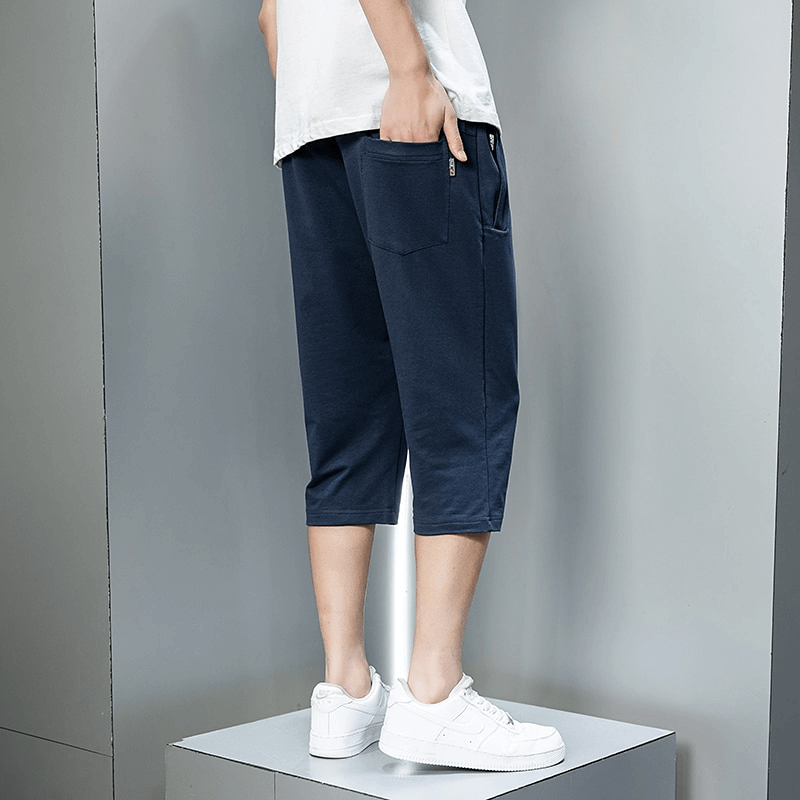 Casual men's breeches with zip pockets in navy blue, showcasing breathable cotton fabric and comfortable fit for outdoor activities.