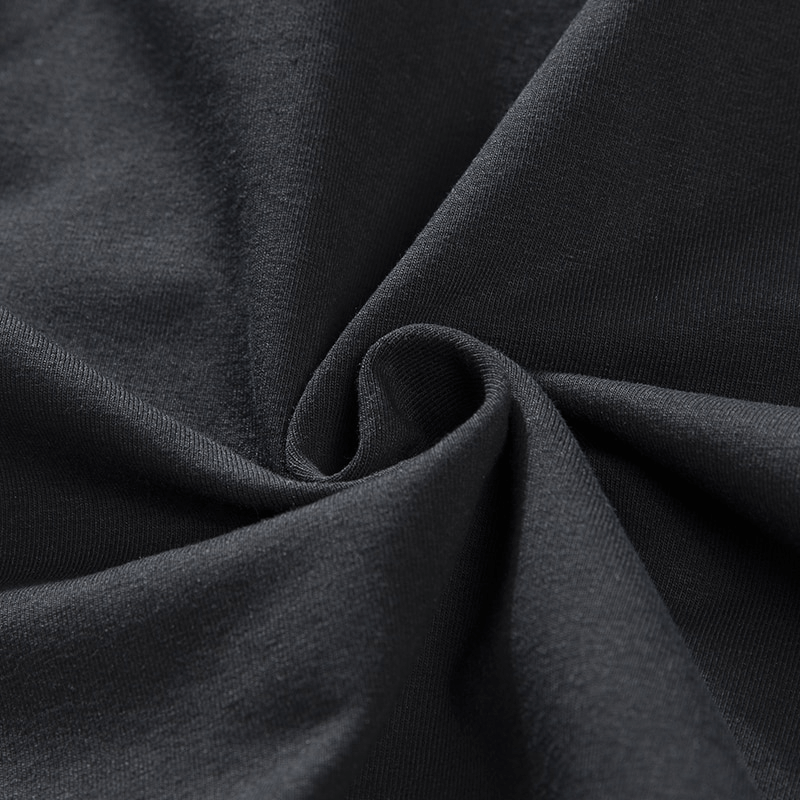 Close-up of breathable cotton fabric texture in dark gray, ideal for men's sportswear like the zip pockets breathable cotton breeches.