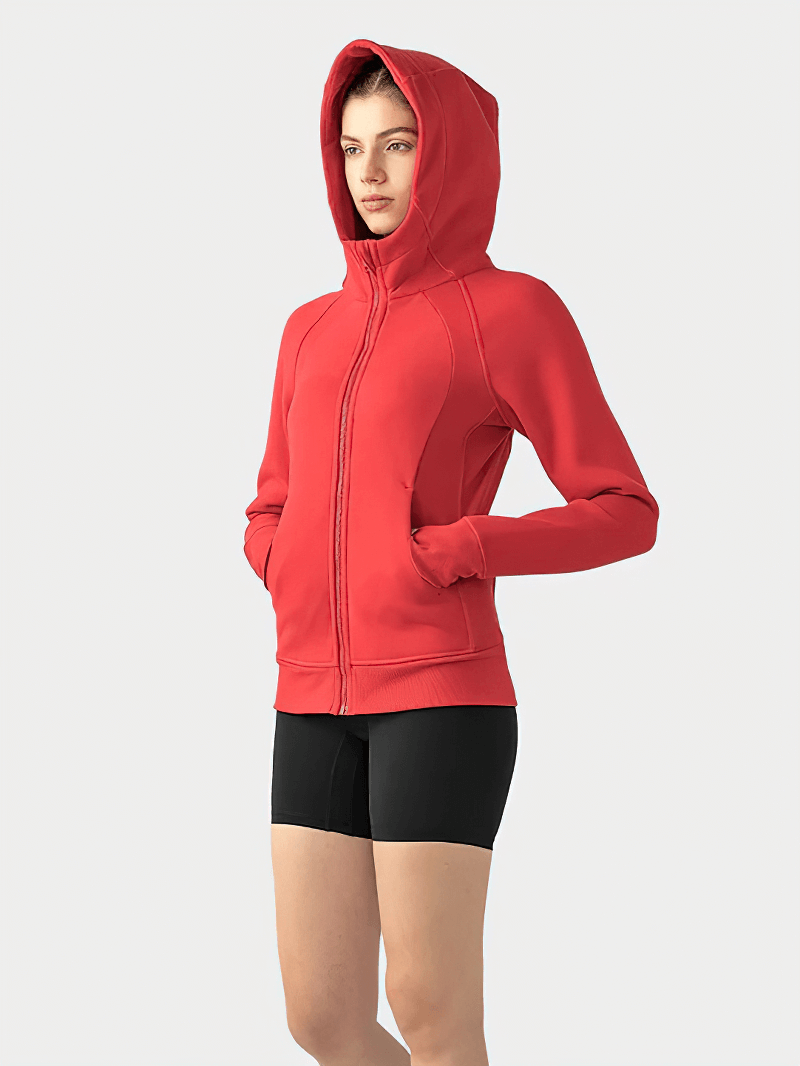 Woman wearing a red zip-up athletic fleece hoodie, product SF1919, standing against a plain background.