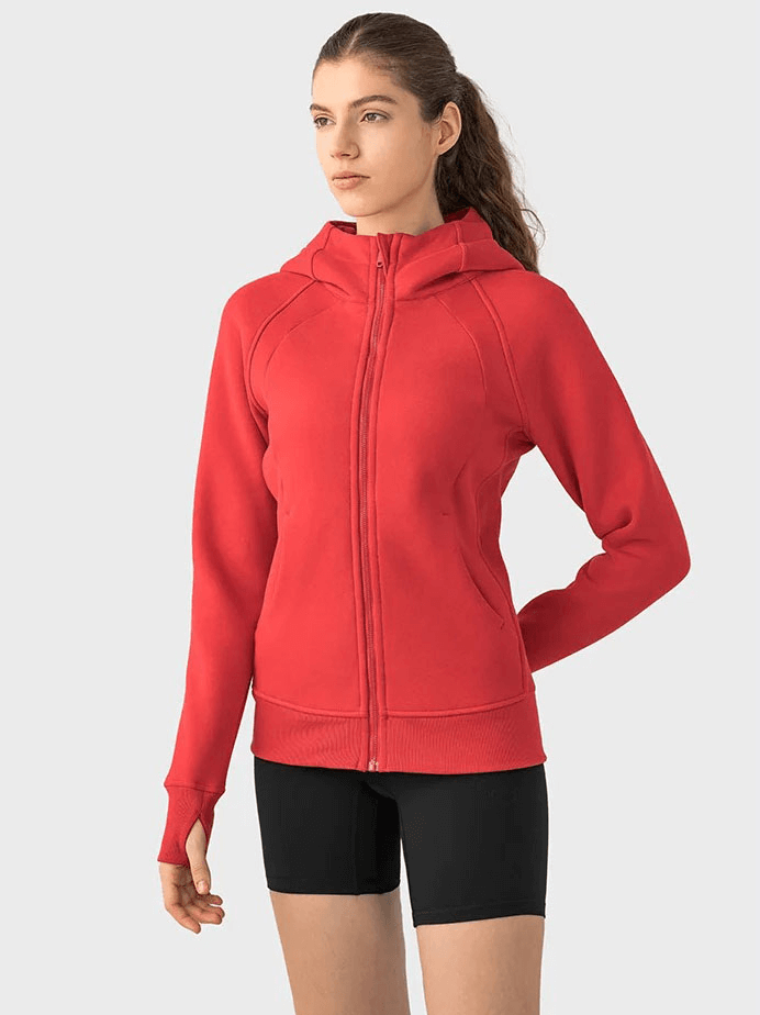 Woman wearing a red zip-up athletic fleece hoodie with full-length sleeves, SF1919 model, perfect for comfort and warmth.