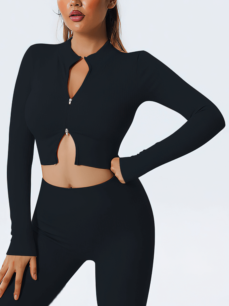 Woman wearing black zipper long sleeve seamless yoga top, perfect for fitness. SF1452, breathable polyester-spandex blend, sleek style.