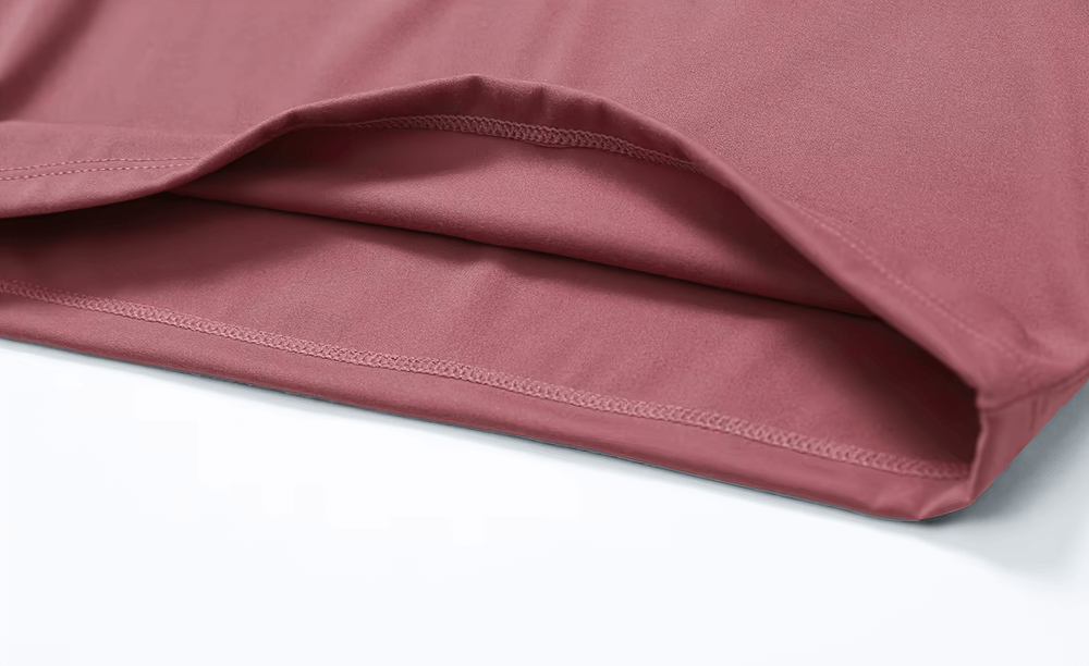Close-up of a pink zipper yoga crop top's fabric showing its durable, stretchable texture made from nylon and spandex. SF2354 model.