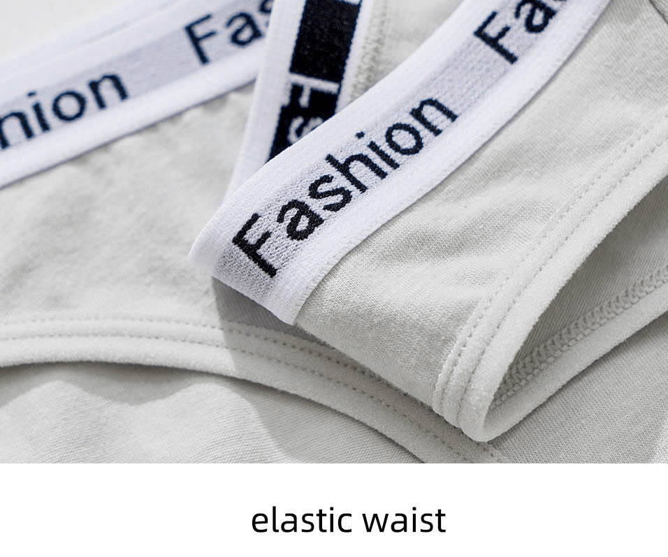 Close-up of women's cotton briefs with 'Fashion' elastic waistband in white, showcasing comfort and style.