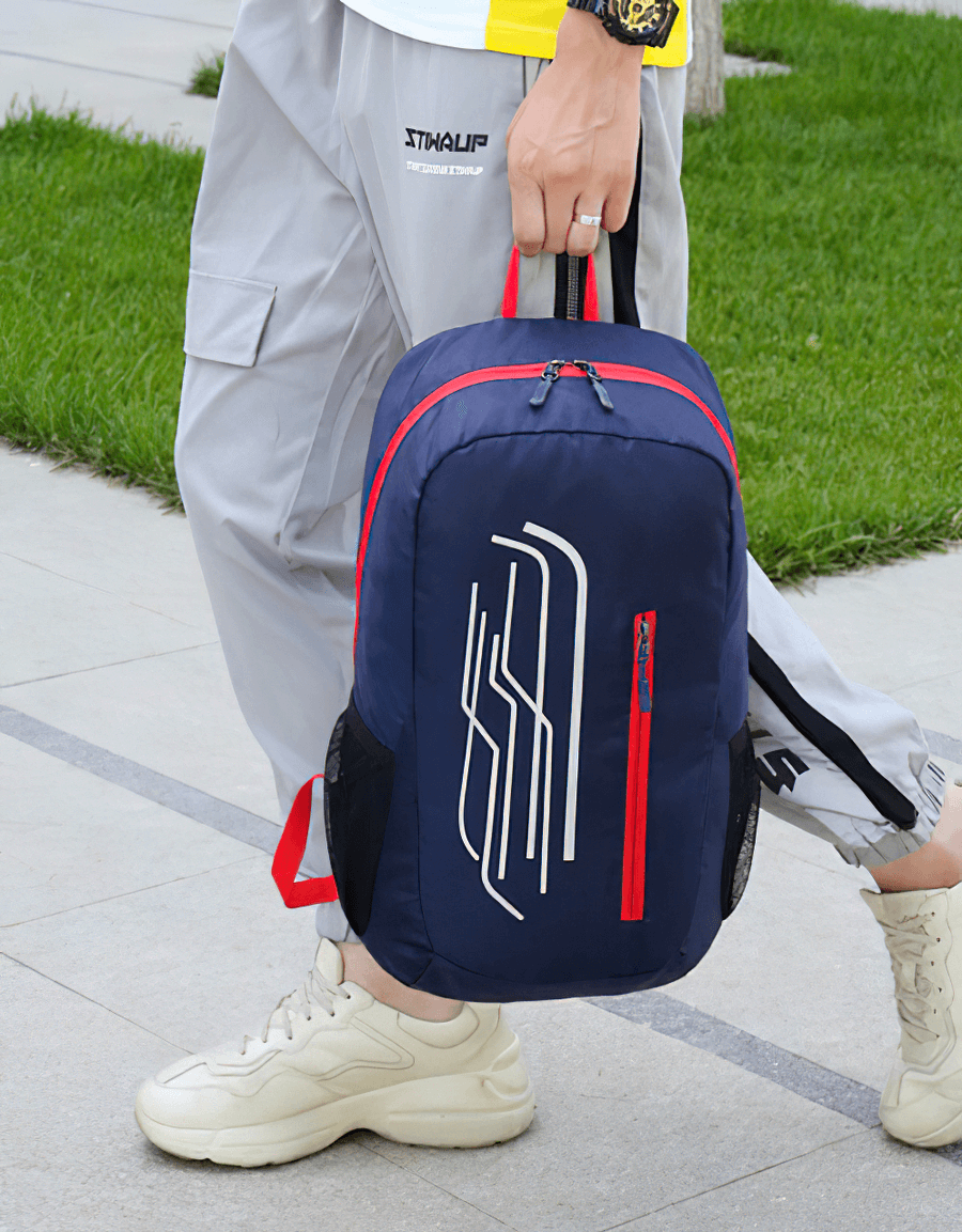 Person holding a blue 22L foldable ultralight cycling backpack with red accents, ideal for adventures and easy storage.