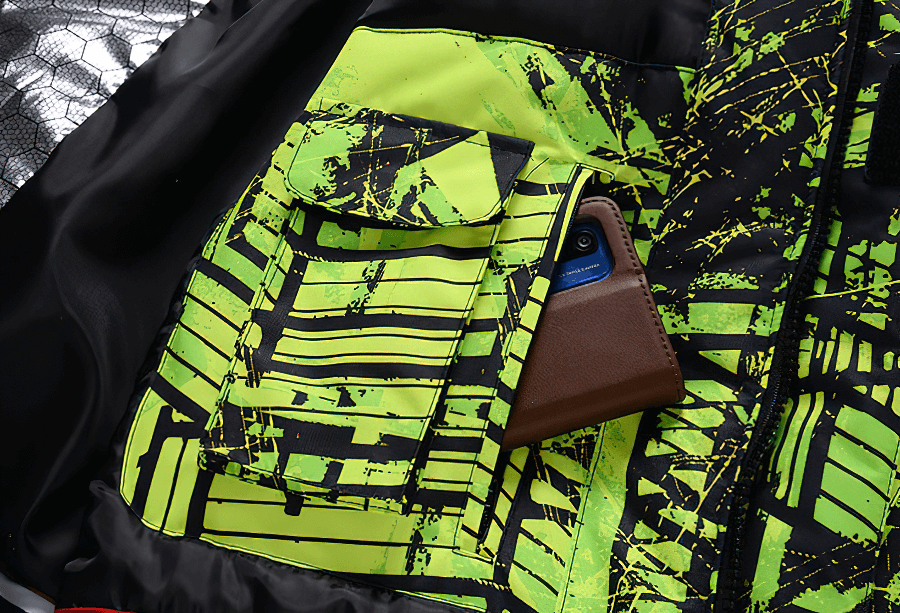 Colorful waterproof snowboarding jacket pocket detail with phone, vibrant green pattern, Minus 30 men's snow gear, insulation, and style.
