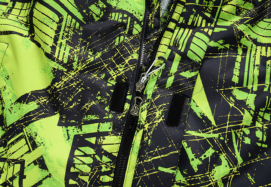 Vibrant green abstract pattern on a waterproof snowboarding jacket for men, featuring a sturdy zipper for outdoor adventures.