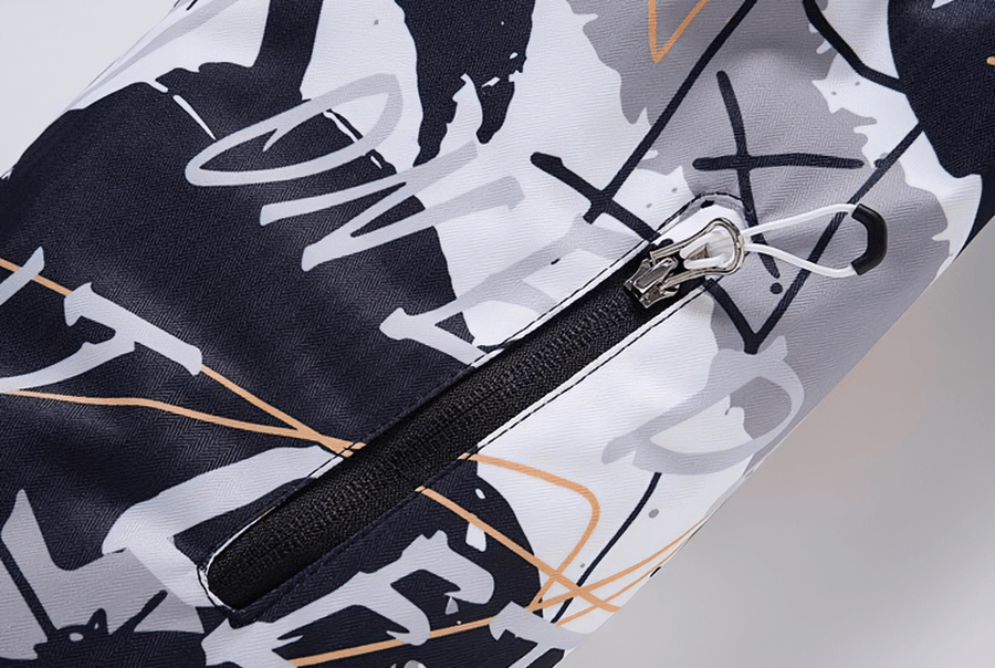 Close-up of zipper on Minus 30 colorful snowboarding jacket with abstract design pattern.