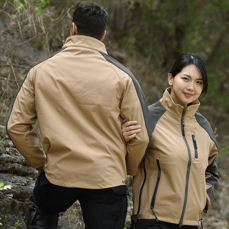 Couple wearing adjustable cuffs Velcro SoftShell hiking jackets, demonstrating style and windproof protection on outdoor adventure.