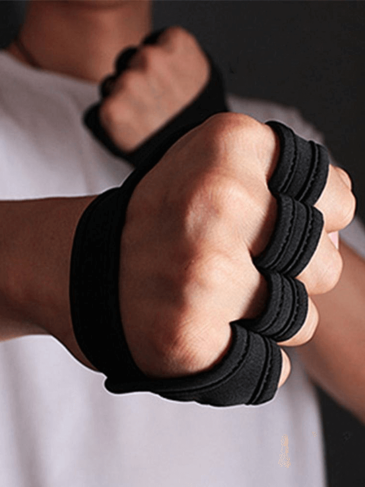 Person wearing black anti-skid exercise gloves, showcasing secure grip and comfort for sports activities.