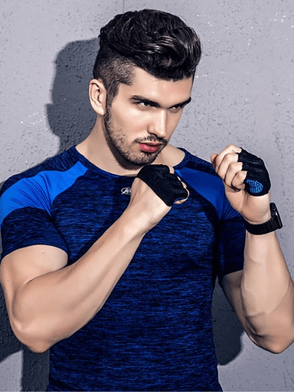 Man wearing anti-slip breathable short gloves with open fingers in a training pose.