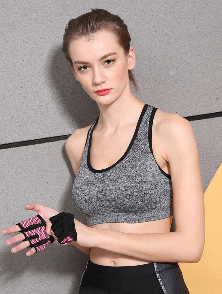Person wearing Anti-Slip Breathable Short Gloves with open fingers, ideal for fitness and training, unisex design in solid color.