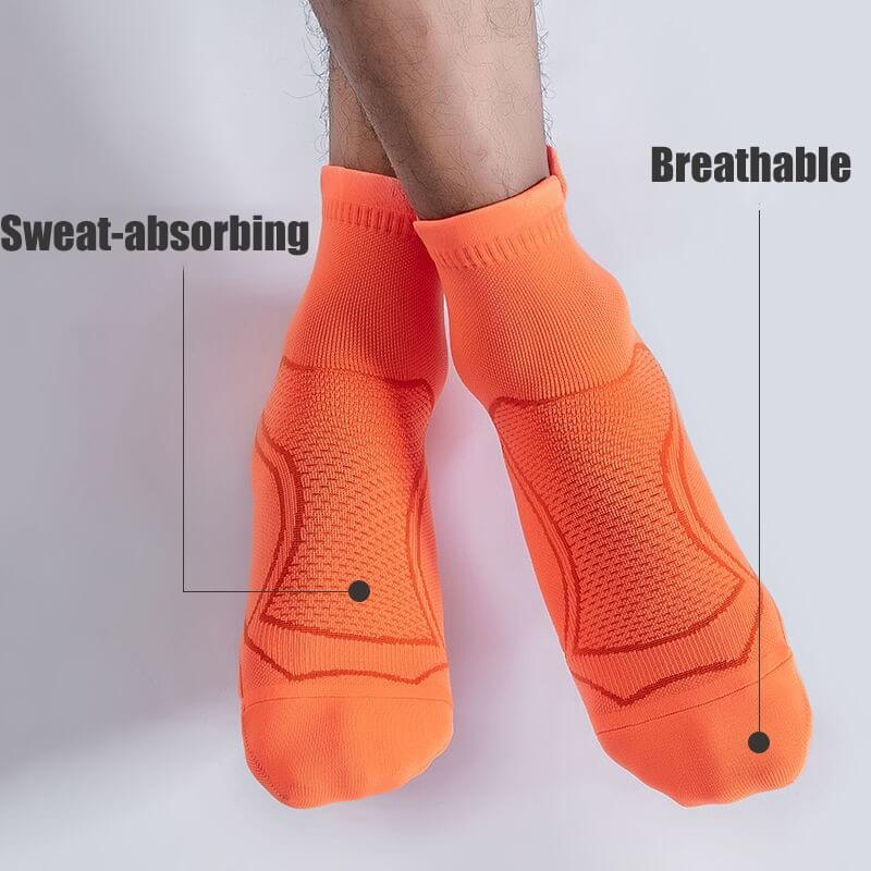 Unisex orange sport socks with breathable and sweat-absorbing technology, ideal for running and fitness activities.