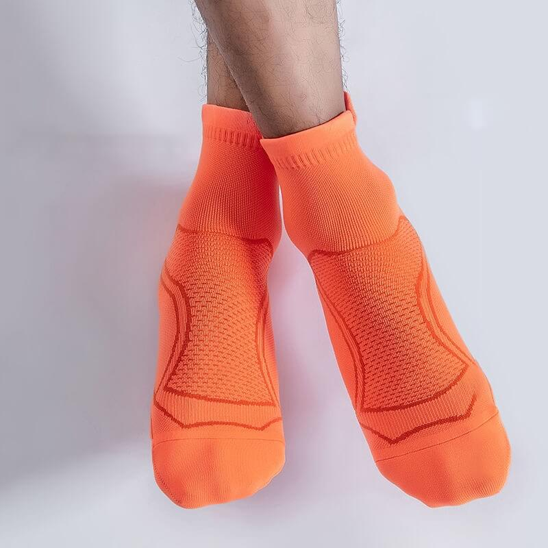 Bright orange unisex sport socks with anti-sweat technology, perfect for running and fitness, offering breathability and comfort. Model SF0765.