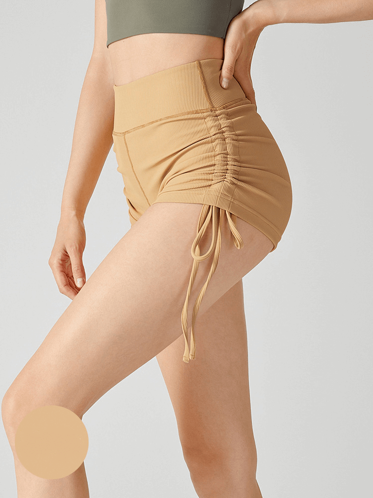 Athletic high waist ribbed shorts with adjustable lanyards for yoga in poly-nylon blend and Lycra, providing comfort and support.