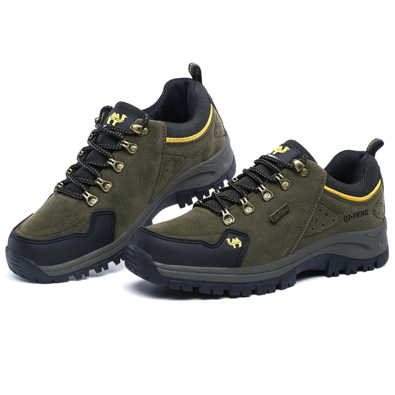 Olive green athletic non-slip waterproof hiking shoes with lace-up closure, showcasing durable leather upper and rubber sole for outdoor trekking.
