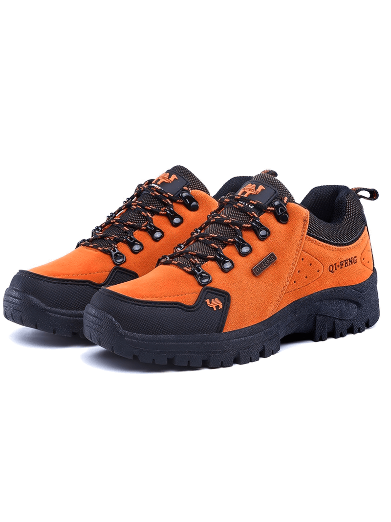 Bright orange non-slip waterproof hiking boots with breathable leather upper and robust rubber sole for outdoor trekking, model SF0246.