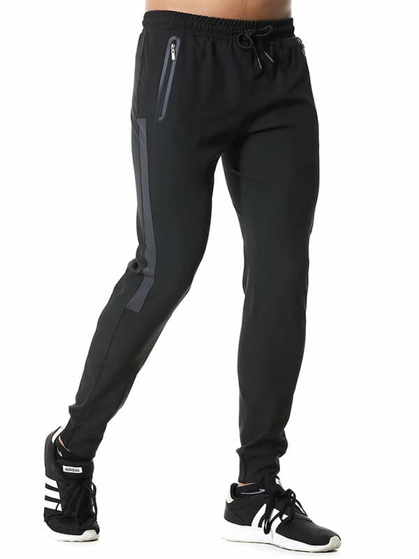 Men's athletic soccer running trousers with zip pockets, full-length black design, elastic waistband, perfect for sports and running.